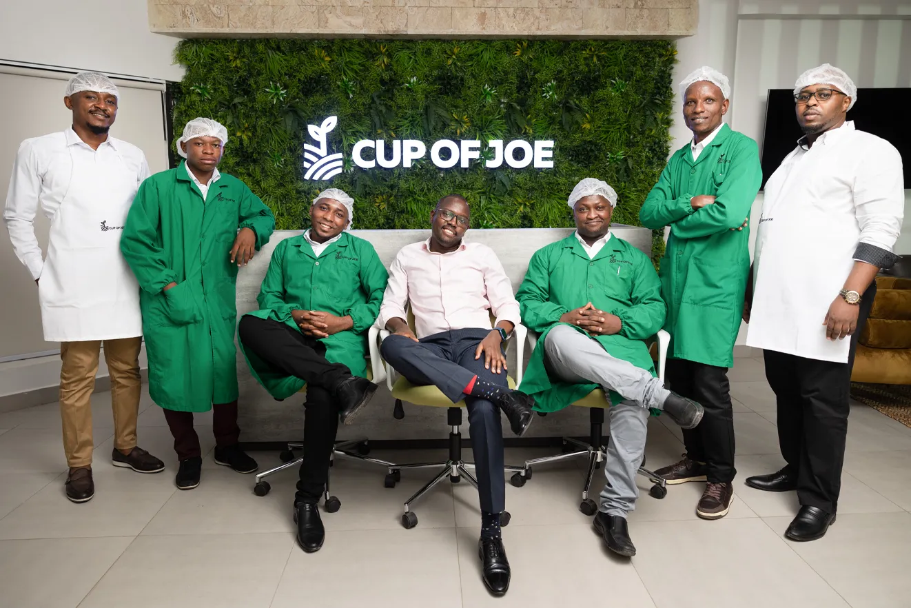 Cup of Joe Limited - Staff in the office posing for a photo